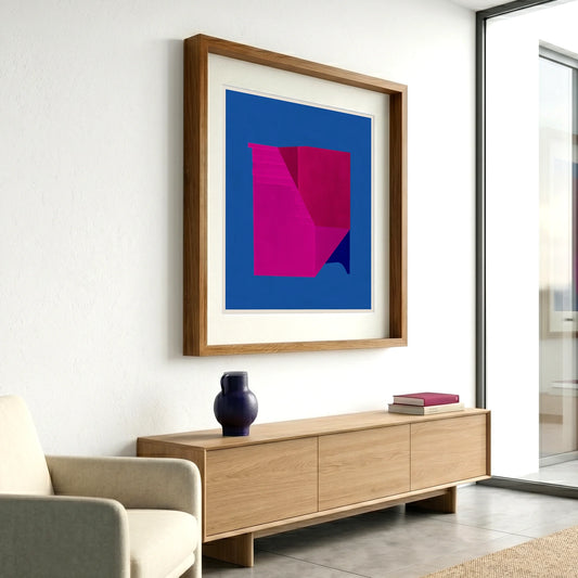 Framed geometric abstract print 495 by Jesús Perea hanging on a white wall in a modern, minimalist living room
