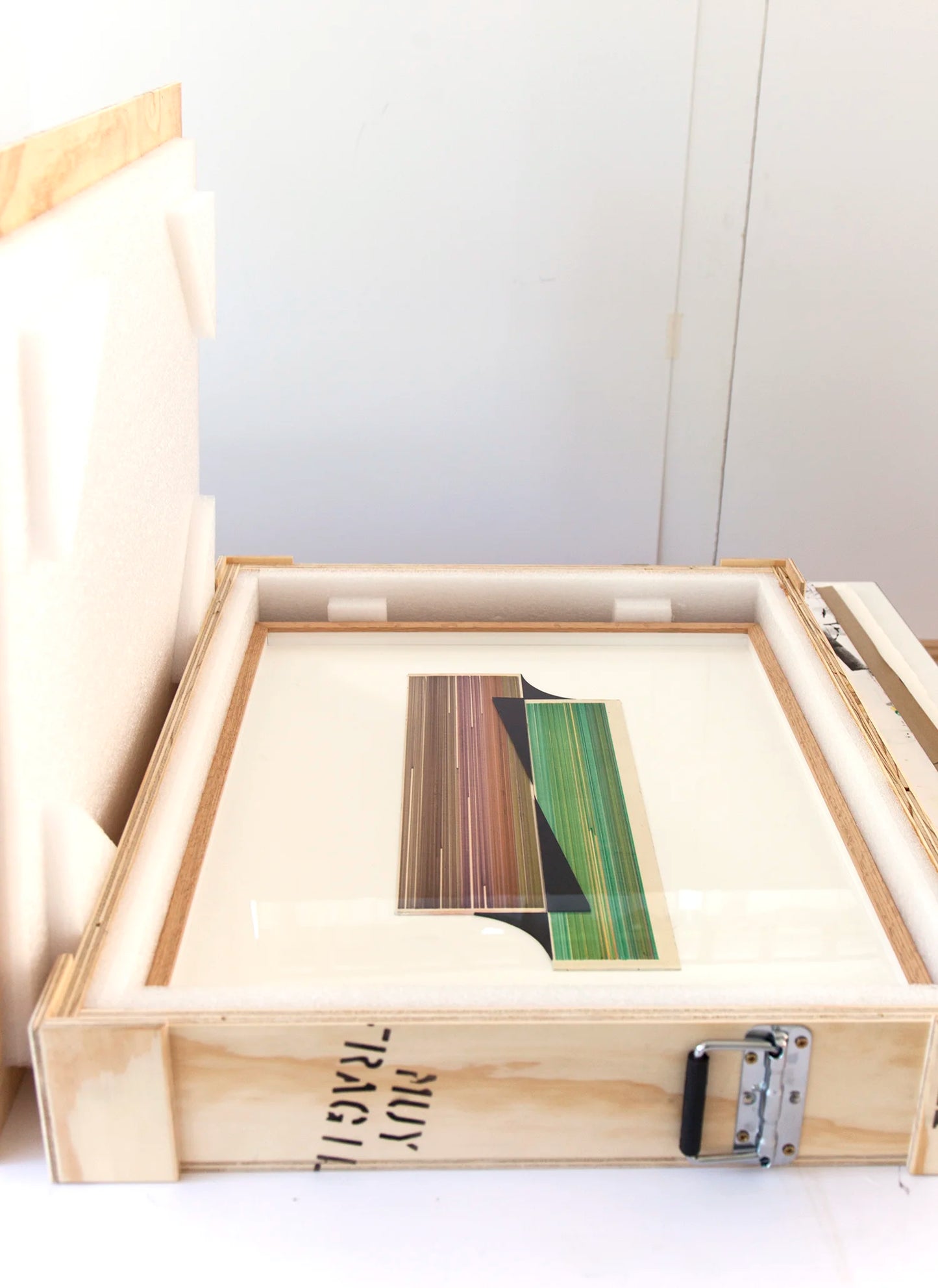 Original abstract mixed media artwork NS15 by Jesús Perea featuring a composition with colorful lines and black shapes on a light beige background, packaged