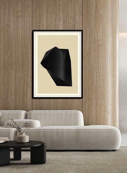 A modern living room features a light grey sofa, black coffee table, and the Abstract composition M250 art print framed on a wooden wall. Neutral tones and simple decor create a calm atmosphere.