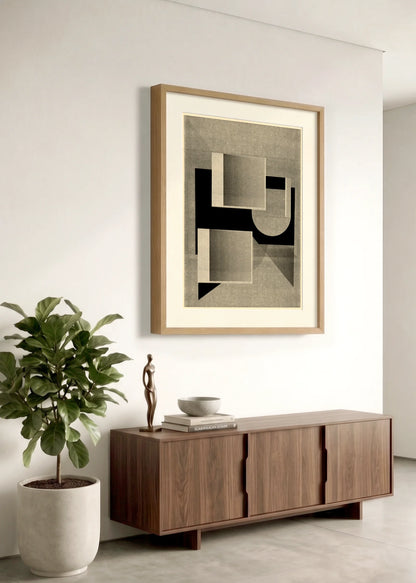 Framed geometric abstract print 995 by Jesús Perea hanging on a white wall in a modern, minimalist living room