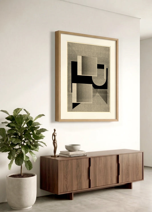 Framed geometric abstract print 995 by Jesús Perea hanging on a white wall in a modern, minimalist living room