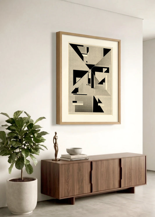 Framed geometric abstract print 991 by Jesús Perea hanging on a white wall in a modern, minimalist living room