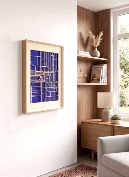 Mediterranean Window geometric artwork by Jesus Perea displayed on a white wall above a modern wooden side table with decorative interior objects.