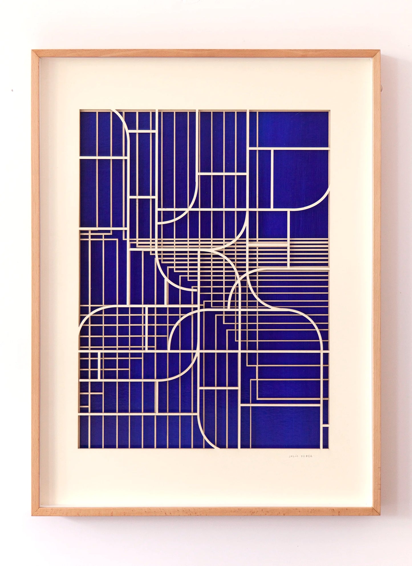 Abstract relief artwork by Jesús Perea, featuring laser-cut museum board layers over a Mediterranean blue background, presented in a light wood frame and titled Ventana 1.